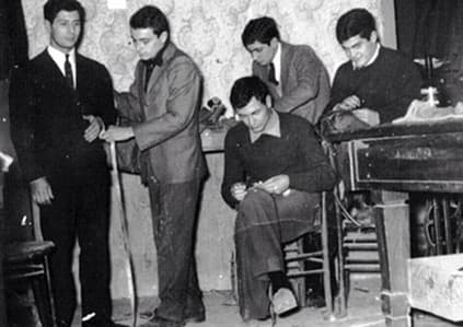 Historic black-and-white photograph of the Sartoria Tofani atelier in Naples.